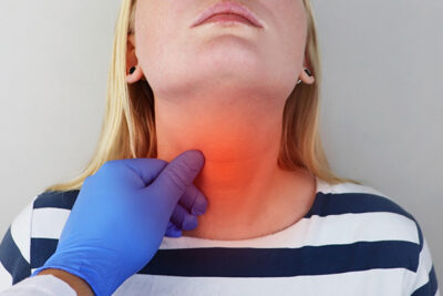 Doctor Examining The Neck For Thyroid Issues In Atlanta